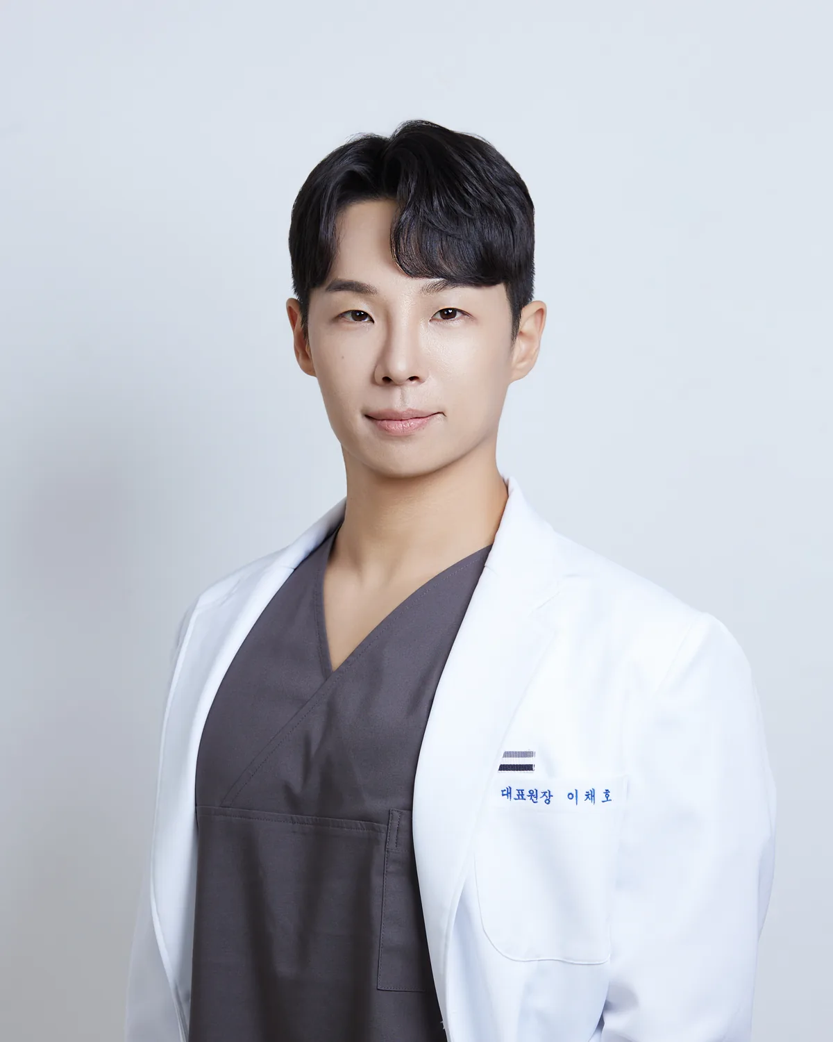 Dr. Chae-Ho Lee, Medical Director, in a white coat